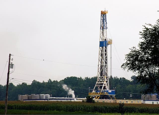 a-large-tower-with-smoke-coming-out-of-it-with-marcellus-formation